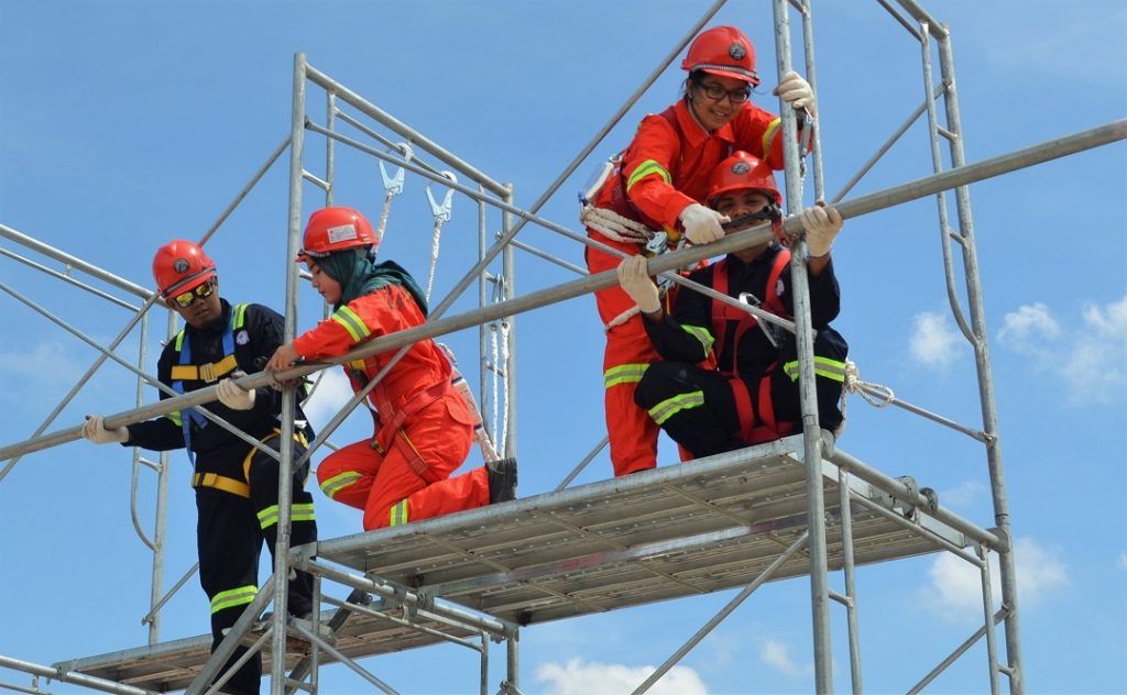Students practicing safety on working at height